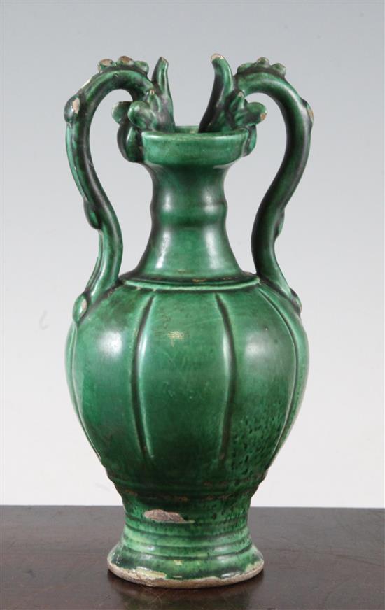 A Chinese green glazed pottery twin handled vase, in Tang style, 20.5cm.